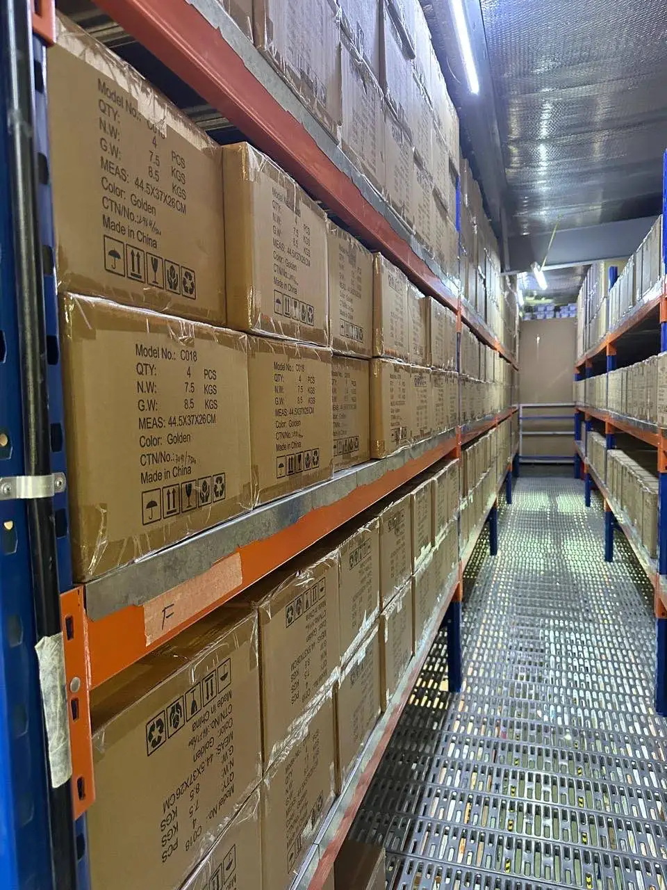 Returned ecommerce items being inspected and sorted for restocking in a Dubai warehouse