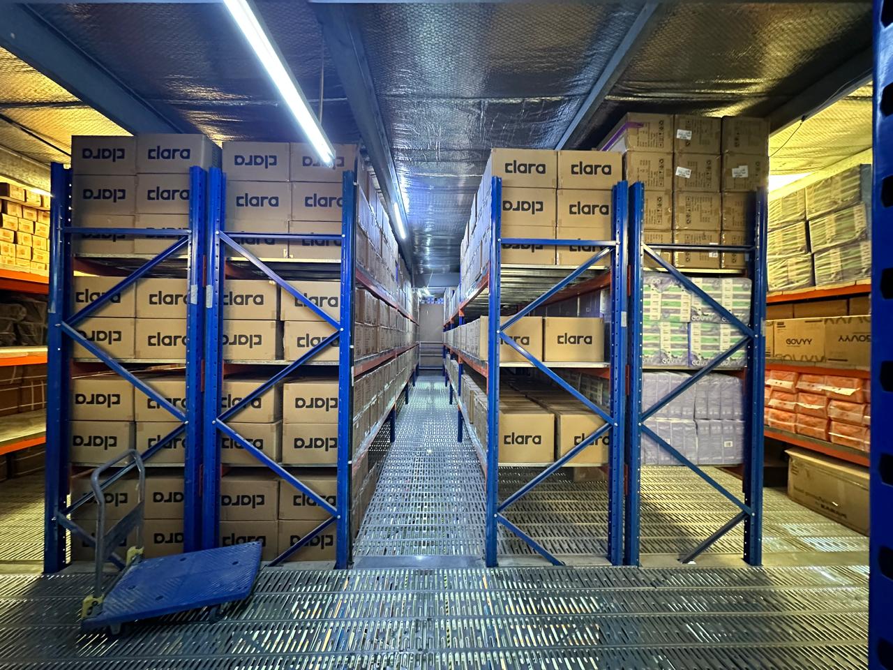 High-bay warehouse racking stocked with cartons